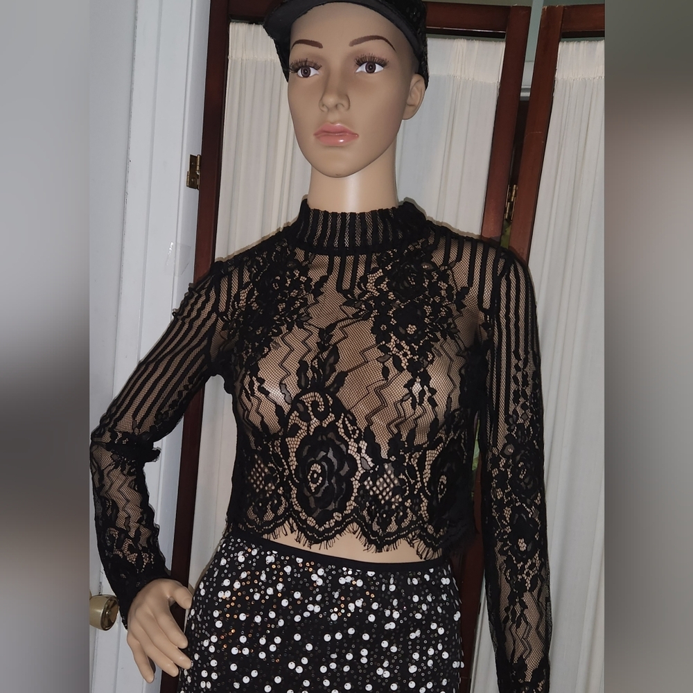 Lace crop top with long sleevesModular neckline, sheer constructionBlack lace